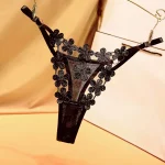 Floral mesh thong with embroidered flower detail, low rise fit, and adjustable straps