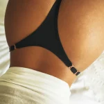 Metal buckle thong with low rise fit and seamless minimalist design