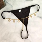 Custom name thong with low waist fit, adjustable straps, and personalized letter detail