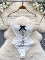 white lace-up corset bodysuit with bow detail and slim feminine design