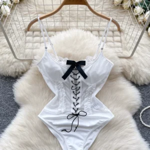 white lace-up corset bodysuit with bow detail and slim feminine design