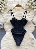 black beaded camisole bodysuit with slim fit and strappy design
