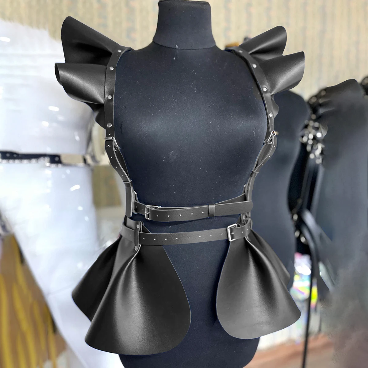 Gothic Harness Belt Skirt Harness Belt Skirt with waist straps, shoulder harness, buckle details, and ruffle hem panels