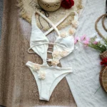 3D flower swimsuit with hollow out detail and floral appliqués