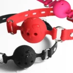 Silicone Ball Gag with breathable ball design, adjustable strap, metal rings, and secure adult roleplay styling