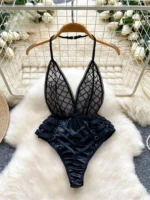 cross design playsuit with halter neckline and backless silhouette