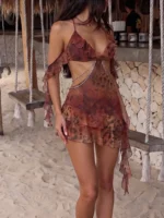 Tropical Mesh Dress with sheer printed fabric, ruffle trim, strap design, mini length, and bold beachwear styling